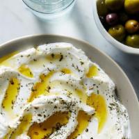Lebne · Curd yogurt mixed with garlic walnuts, dill and olive oil.