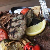 Lamb Mixed Grill · Combination of kofte, lamb adana and doner kebab served with turkish rice and vegetables. Se...