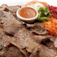 Lamb Doner Kebab · Most poluar.  Vertically grilled lamb gyro sliced very thin and served with rice and vegetab...
