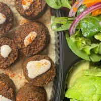 Falafel Platter · Served with rice, pita bread, vegetables, lettuce, onions, tomato and red cabbage.