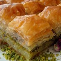 Baklava · Pastry with mixed nuts, syrup and ground pistachio topping.
