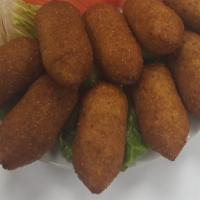 Kibbeh · 12 pieces of perfectly spiced beef inside a bulgar wheat shell.