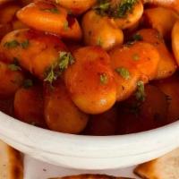 Gigandes Small · Jumbo lima beans baked in a red sauce and served with pita