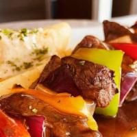 Filet Mignon Kebob · 9 oz Certified Angus Marinated Filet Mignon skewered With Peppers & Onions.