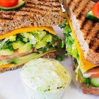 Avocado English Cheddar Vegetarian Sandwich · With tomatoes, lettuce, cucumbers, and herbal mayo on multigrain bread.