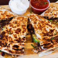Grilled Chipotle Chicken Quesadilla · With jack and cheddar cheeses, sauteed peppers, sliced avocado, caramelized onions, jalapeno...