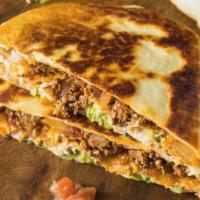 Chicken & Steak Combo Quesadilla · Mouthwatering Quesadilla made with fresh Mozzarella cheese, and cheddar cheese. Topped with ...