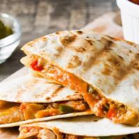 Chicken Quesadilla · Mouthwatering Quesadilla made with fresh Mozzarella cheese, and cheddar cheese. Topped with ...
