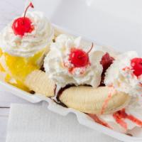 Banana Split · Delicious fresh banana slices and ice cream, topped with whipped cream and cherries!