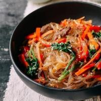 Japchae · Japchae is a savory and slightly sweet dish of stir-fried glass noodles and vegetables that ...