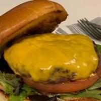 Cheese Burger Quarter Pounder · Served on a toasted brioche bun with melted American Cheese, Greens and Tomato