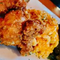 Southern Fried Chicken · Down home fried chicken served with macaroni and cheese and collard greens.