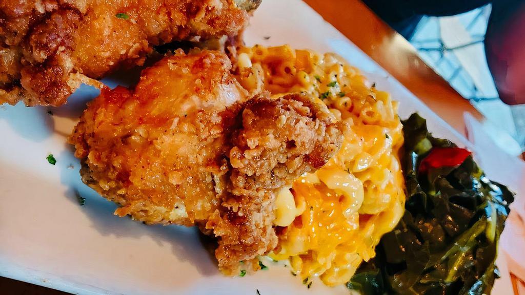 Southern Fried Chicken · Down home fried chicken served with macaroni and cheese and collard greens.