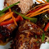 Jerk Chicken · Spicy leg quarters marinated in our house blend jerk seasoning. Served with rice and peas, c...