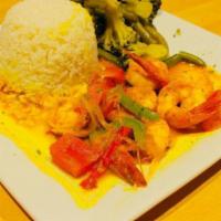 Curry Shrimp · Shrimp sautéed in spicy Caribbean curry served with white rice and butter garlic sautéed ste...