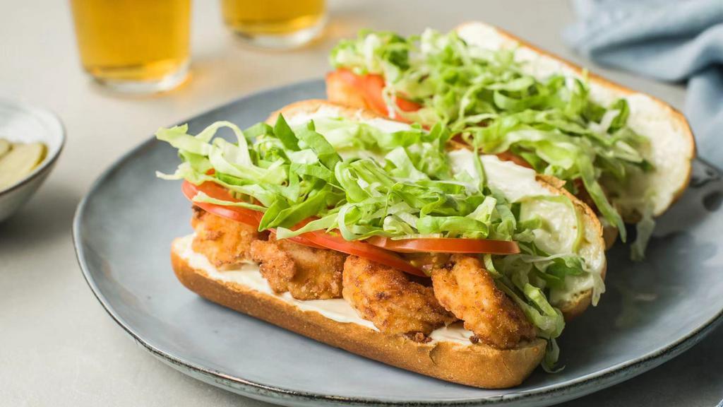 Fried Shrimp Po Boy · Sandwich with shrimp deep fried, tomato, romaine and homemade sauce. Served with your choice of fries