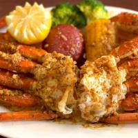 Large Catch Snow Crab Legs · 1 lb fresh snow crab legs tossed in flavorful seasoning and spice of choice. Served with cor...