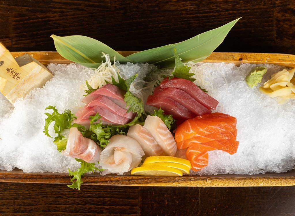 Sashimi Deluxe · 16 pieces of assorted raw fish and rice.