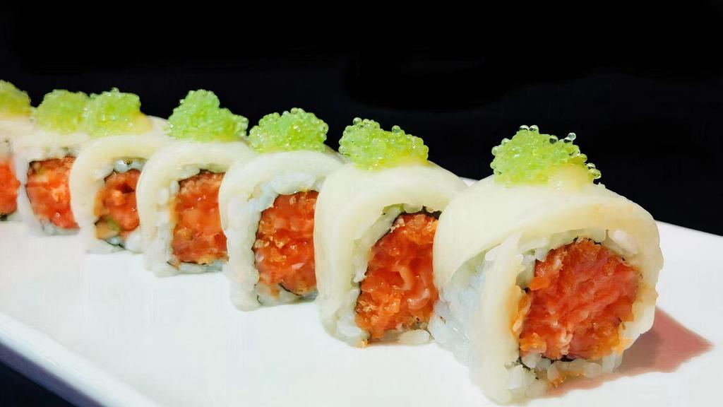 Dancing Salmon Roll · Spicy salmon and crunchy topped with white tuna, miso sauce, and wasabi caviar.