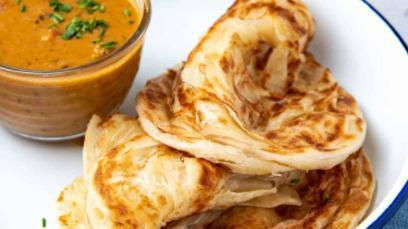 Roti Canai · Indian pancake with curry sauce. Hot and spicy.