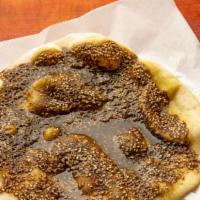 Zaatar Pie · Wild dried thyme, sesame, sumac, and oil.