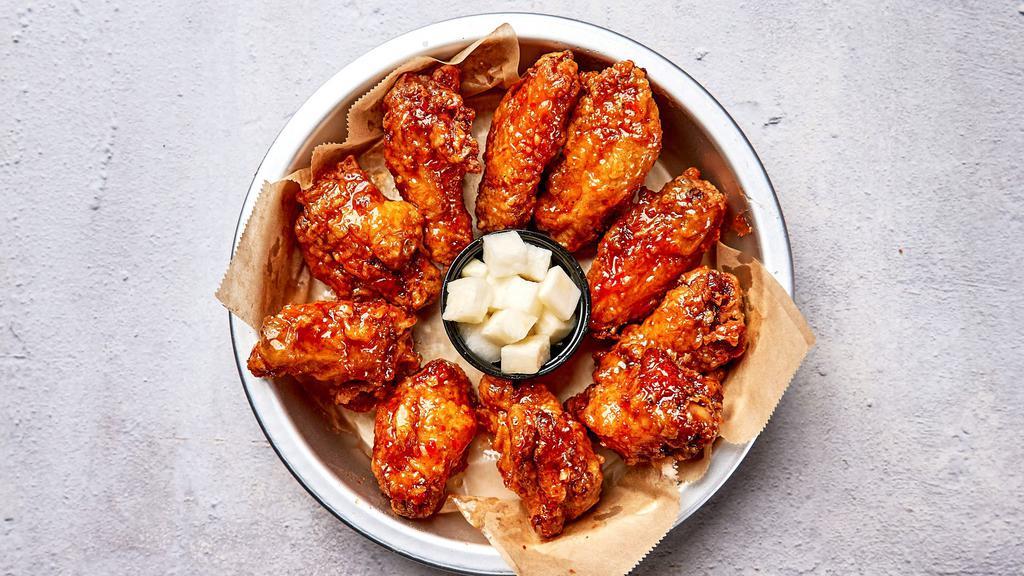 Sweet Thai Chili Wings · Bell & Evans wings fried in our special olive oil blend and painted with our sweet thai chili glaze. Served with pickled radish.