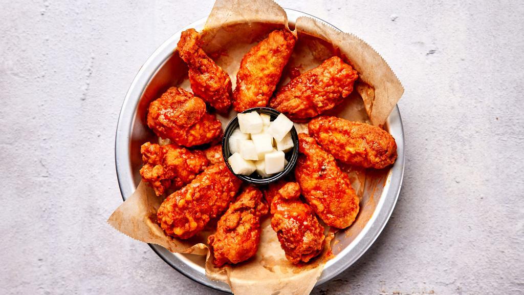 Original Buffalo Wings · Bell & Evans wings fried in our special olive oil blend and painted with our lip smacking buffalo sauce. Served with house made pickled radish.