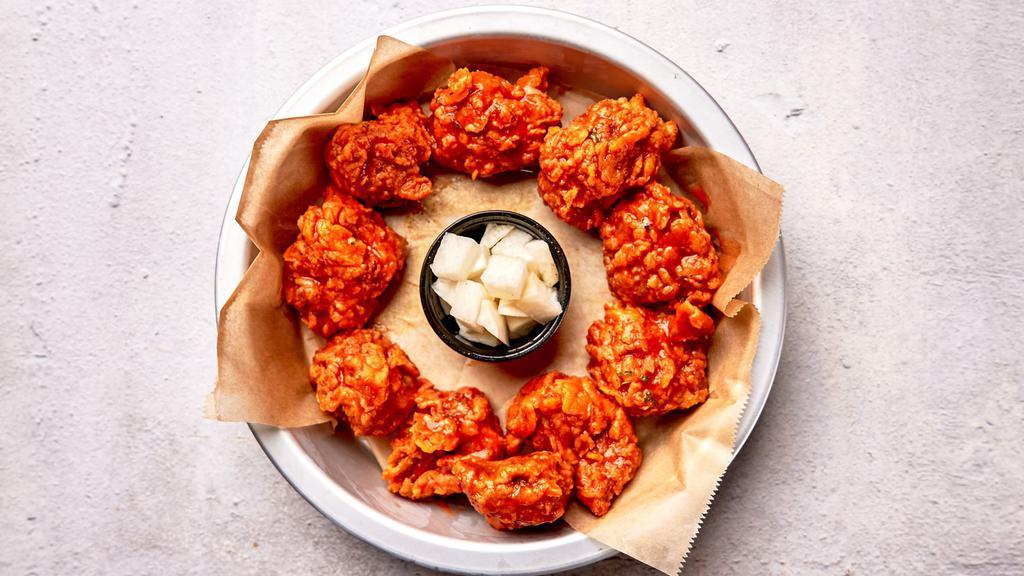 Original Buffalo Boneless Wings · Bell & Evans boneless chicken fried in our special olive oil blend and painted with our lip smacking buffalo sauce. Served with house made pickled radish.