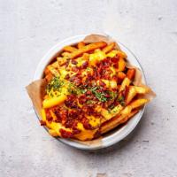 Bacon Cheese Fries · Crispy handcut fries with our homemade cheese sauce topped with a crispy bacon crumble.