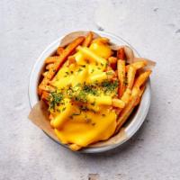 Cheese Fries · Crispy handcut fries with our homemade cheese sauce.