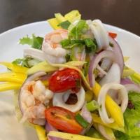 Shredded  Mango Salad · Spicy. With shrimp, squid, peanut, cashew nut, chili and lime juice.