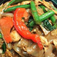 Pad Kee Mao · Favorite. Spicy. Flat rice noodle with stir fried chili basil sauce, egg, string bean, carro...