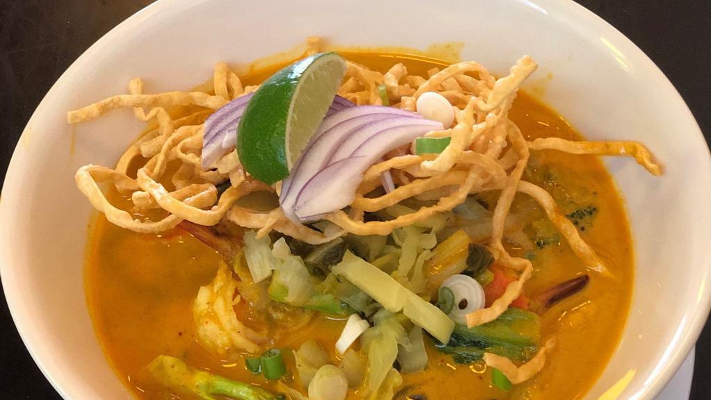 Kao Soy · Spicy. Egg noodle curry, coconut milk soup, red onion, pickle green mustard and scallion.