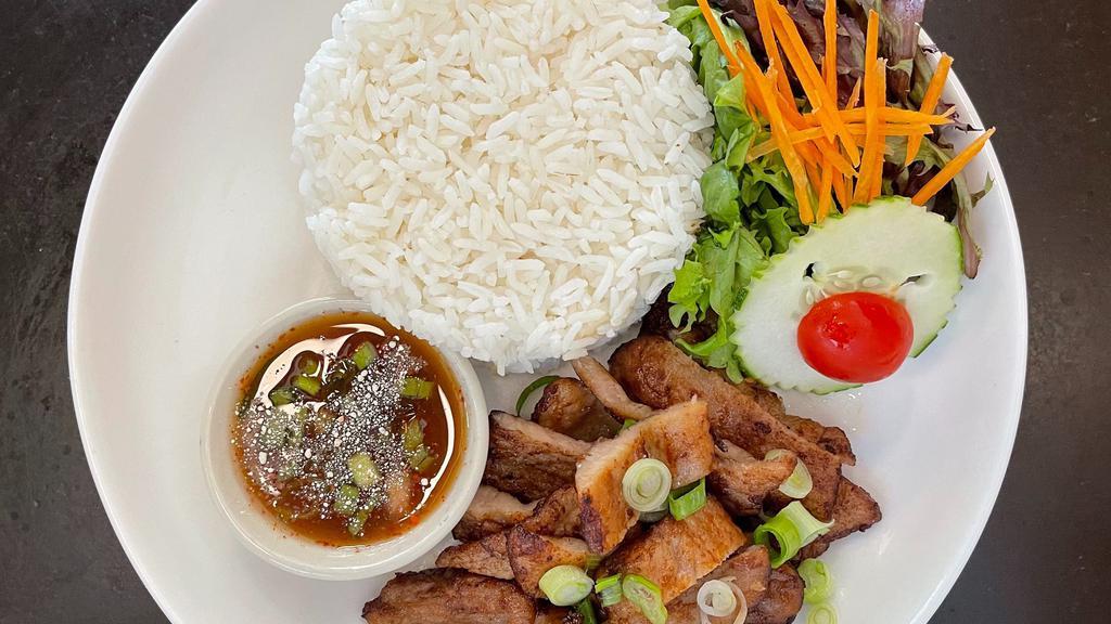 Fried Marinated Pork Over Rice · Special marinated pork over rice.