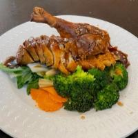 Tamarind Duck · Fried half roasted duck bed on steamed mix vegetable and tamarind sauce