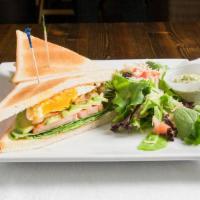 Avocado Egg Blt · Avocado, egg, bacon, lettuce, tomato on toasted bread and salad.