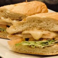 Chicken Sandwich · Breaded chicken, ham, cheese, lettuce, tomato and mayo.
