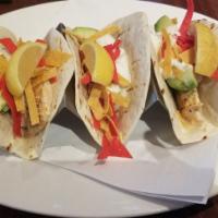 Mahi-Mahi Fish Tacos · grilled mahi-mahi, pico de gallo, avocado, ranch, tortilla strips, flour tortilla. Gluten-fr...
