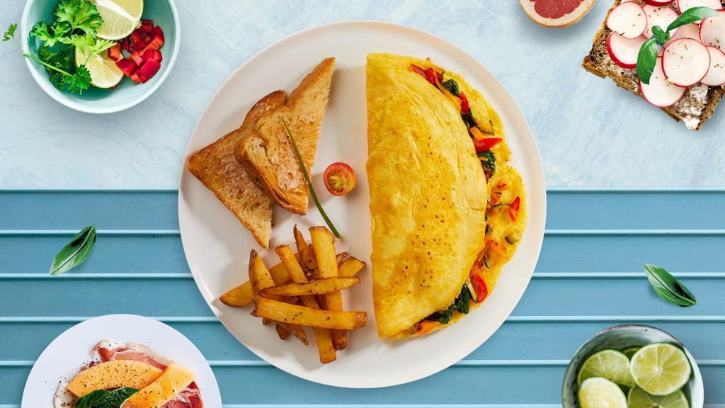 Healthy Omelette · Eggs cooked with onion, pepper, spinach, avocado, and cheese served with home fries and toast.