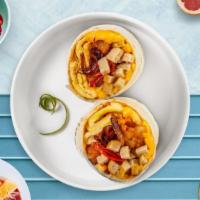 Sausage Breakfast Burrito · Turkey sausage, eggs, cheddar cheese, tomatoes, hashbrown, and onions wrapped in a flour tor...