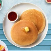 Classic Pancakes · Fluffy pancakes cooked with care and love served with butter and maple syrup. Three pieces.