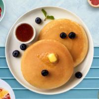 Blueberry Chip Pancakes · Fluffy pancakes cooked with care and love served with blueberries, butter and maple syrup. S...