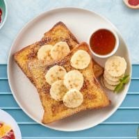 Banana French Toast · Fresh bread battered in egg, milk, and cinnamon cooked until spongy and golden brown. Topped...