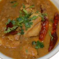 M13 Chicken Curry · Chicken cooked in thick curry sauce , garnished with cilantro