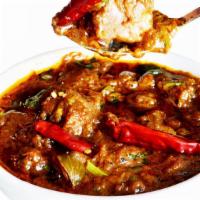 M23 Goat Chettinad · Goat Cooked in chettinad style sauce