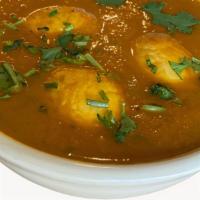M26 Egg Curry · Egg simmered with ginger/garlic onion sauce.