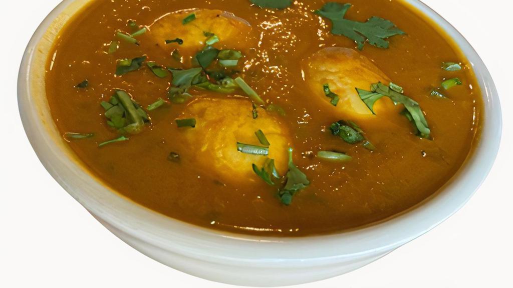 M26 Egg Curry · Egg simmered with ginger/garlic onion sauce.
