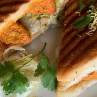 P6 Chicken  Panini · Chicken in creamy tandoori sauce with fresh tomatoes, lettuce, green peppers, mint and garli...