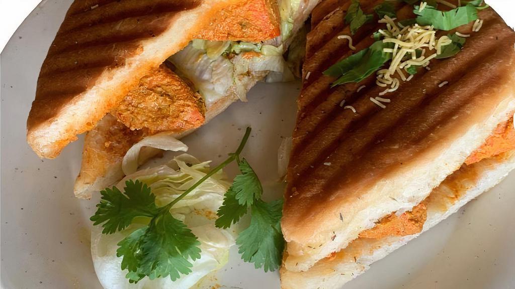 P6 Chicken  Panini · Chicken in creamy tandoori sauce with fresh tomatoes, lettuce, green peppers, mint and garlic chutney. * Halal*