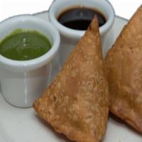B1 Samosa(2) Plate · Fried pastry with a savory spiced potatoes with herbs filling served with mint and tamarind ...